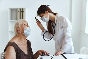 female doctor stethoscope in hand health care photo