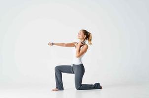 woman sitting on the floor doing sports exercise photo