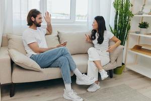 Young couple husband and wife fight and yell at each other because of disagreements in the family, psycho emotional unstable state in the family, couple's divorce photo