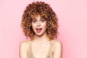 Pretty woman curly hair Red lips surprised look cropped view photo