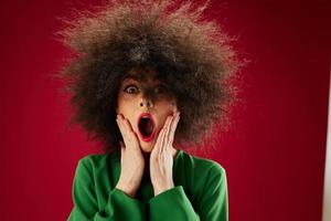 Beauty Fashion woman Afro hairstyle green dress emotions close-up red background unaltered photo