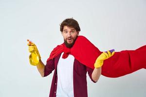 Man in red raincoat rubber gloves cleaning professional homework photo