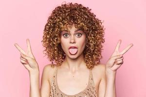 Female Show tongue and two finger curls portrait fashionable clothes photo