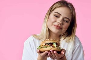 woman in white t-shirt hamburger snack delicious food restaurant photo