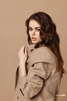 pretty woman in coat glamor cosmetics model isolated background photo