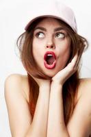 Portrait of a woman in a cap Looks to the side with open mouth charm evening makeup photo