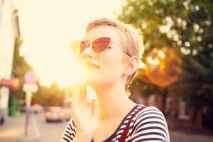 cheerful woman wearing sunglasses walk lifestyle romance photo