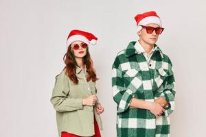 Man and woman in black glasses New Year hats fashion Friendship holiday photo