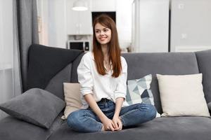 woman at home on the couch rest Comfort in the apartment photo