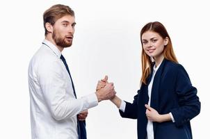 man and woman in suits are holding hands of work colleagues close-up photo