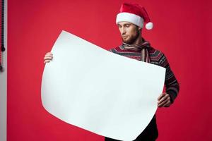 Cheerful man in a christmas white mockup poster red background photo