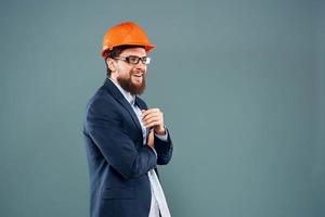 Engineer in orange paint job industry professional construction blue background photo