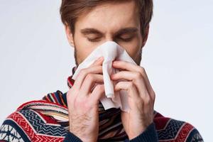 sick man sweater health problems handkerchief flu infection light background photo