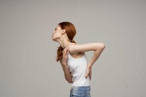 woman back pain health problems osteoporosis isolated background photo