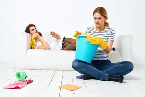 Married couple joint cleaning house cleaning supplies lifestyle photo