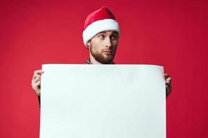 Cheerful man in a christmas white mockup poster studio posing photo