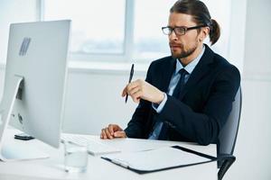 office worker at the desk with glasses work technologies photo