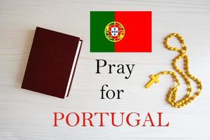 Pray for Portugal. Rosary and Holy Bible background. photo
