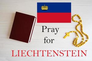 Pray for Liechtenstein. Rosary and Holy Bible background. photo