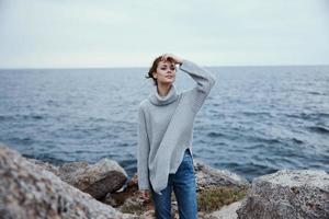 woman nature rocks coast landscape Ocean female relaxing photo