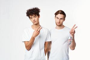 two men are standing next to clean t-shirts emotions communication studio photo