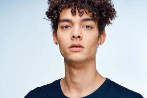 cute guy curly hair black t-shirt close-up model photo