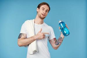 handsome man in white t-shirt sport water bottle health workout lifestyle photo