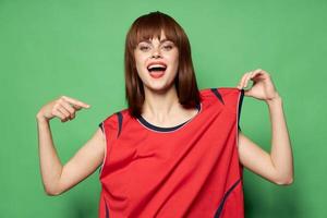 woman in a sports T-shirt getting ready for a soccer team match photo