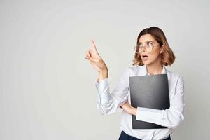 woman in white shirt documents office official success photo