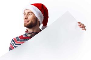 emotional man in New Year's clothes holding a banner holiday isolated background photo