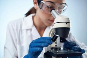 female laboratory assistant science research microbiology photo