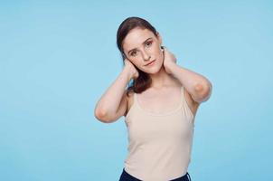 Young woman on blue background close-up photo