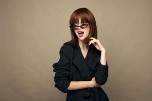 Luxurious woman classic coat good mood posing studio photo