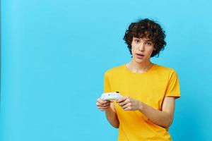 curly guy in plays games gamepad technologies photo