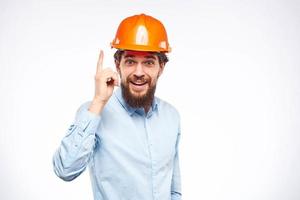 Engineers shirt orange hard hat construction lifestyle emotions cropped view light background photo