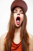 Beautiful woman in a cap Open mouth closed eyes luxury model photo