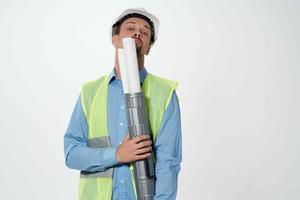 man in construction uniform blueprints builder isolated background photo