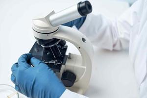 female laboratory assistant microscope research biotechnology nothing photo