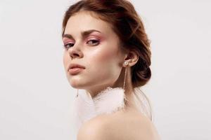 Cheerful Woman Bare Shoulders Fluffy Earrings Cosmetics Jewelry photo