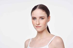 pretty woman in white t-shirt clean leather close-up isolated background photo