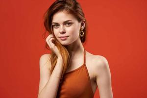 pretty woman in red t-shirt earrings summer fashion photo