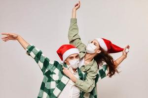 Family holiday Christmas and fun medical mask New Year's hat photo