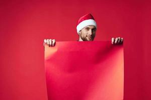 Cheerful man in a christmas red mockup poster studio posing photo