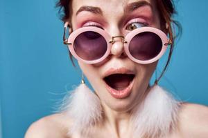 cheerful woman with bare shoulders round glasses decoration emotions photo