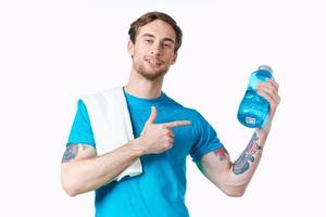 Cheerful man sport workout water bottle cropped view photo