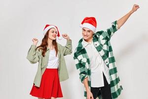 enamored man and woman gesturing with their hands on a light background fun New Year photo