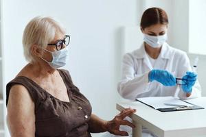 doctor with a syringe patient injection immunization safety vaccine passport photo