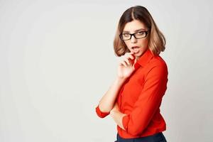 woman in red shirt posing fashion official light background photo