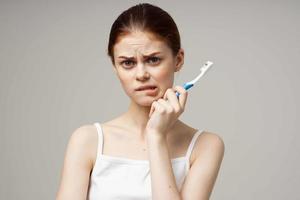 cheerful woman in white t-shirt dental hygiene health care studio lifestyle photo