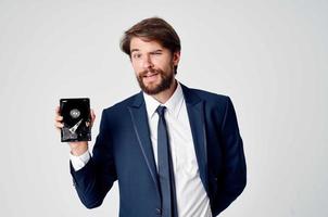 business man in suit hard drive information data recovery photo